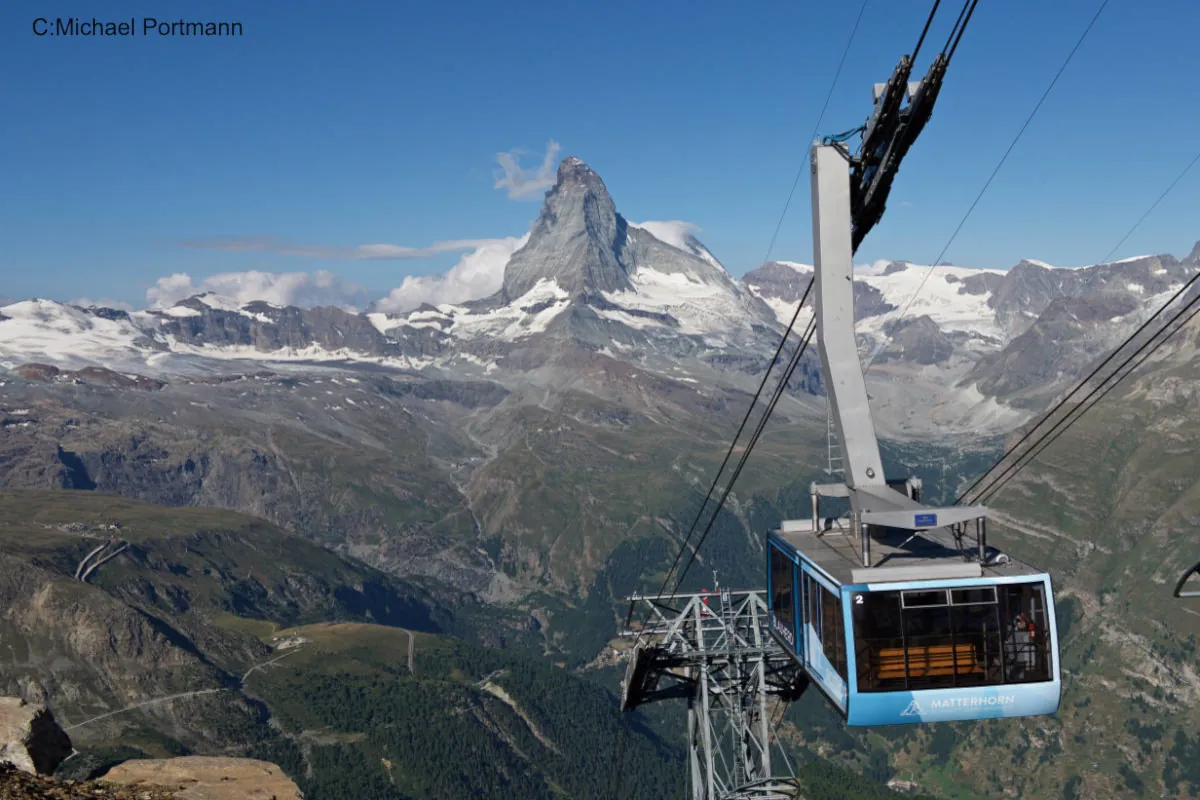 Gondola rising uphill with Matterhorn in background